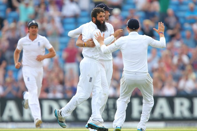 LEEDS, ENGLAND - JUNE 22: Moeen Ali of England celebrates taking the wicket of Lahiru Thirimanne of Sri Lanka during day three of the 2nd Investec Test match between England and Sri Lanka at Headingley Cricket Ground on June 22, 2014 in Leeds, England.  (Photo by Dave Thompson/Getty Images)