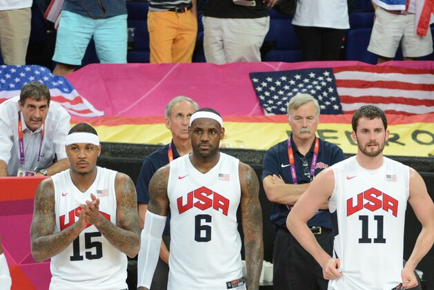 LONDON, ENGLAND - AUGUST 12: Chris Paul #13, Carmelo Anthony #15, LeBron James #6, Kevin Love #11, Kobe Bryant #10 and Kevin Durant #5 of the US Men's Senior National Team celebrates against Spain during their Men's Gold Medal Basketball Game on Day 16 of the London 2012 Olympic Games at the North Greenwich Arena on August 12, 2012 in London, England. NOTE TO USER: User expressly acknowledges and agrees that, by downloading and/or using this Photograph, user is consenting to the terms and conditions of the Getty Images License Agreement. Mandatory Copyright Notice: Copyright 2012 NBAE (Photo by Garrett W. Ellwood/NBAE via Getty Images)
