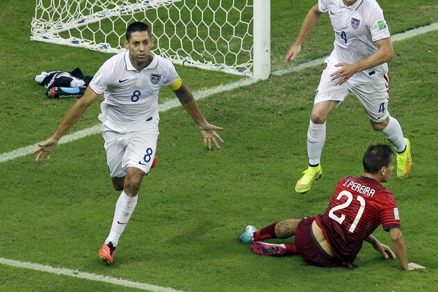 United States' Clint Dempsey, left, celebrates scoring his side's second goal during the group G World Cup soccer match between the USA and Portugal at the Arena da Amazonia in Manaus, Brazil, Sunday, June 22, 2014. (AP Photo/Themba Hadebe)