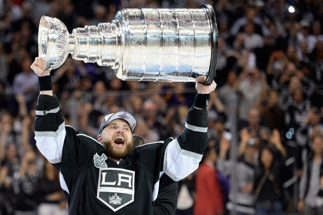 LOS ANGELES, CA - JUNE 13:  Marian Gaborik #12 of the Los Angeles Kings hoists the Stanley Cup in celebration after defeating the New York Rangers 3-2 in double overtime of Game Five of the 2014 Stanley Cup Final at Staples Center on June 13, 2014 in Los Angeles, California.  (Photo by Harry How/Getty Images)