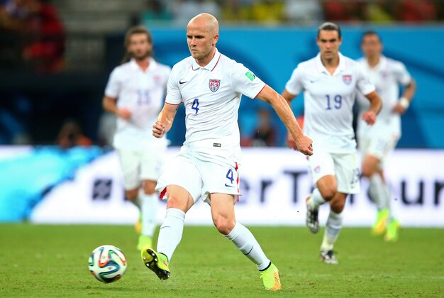 Jun 22, 2014; Manaus, Amazonas, BRAZIL; USA midfielder Michael Bradley (4) controls the ball in the second half against Portugal during the 2014 World Cup at Arena Amazonia. The game ended in a 2-2 draw. Mandatory Credit: Mark J. Rebilas-USA TODAY Sports