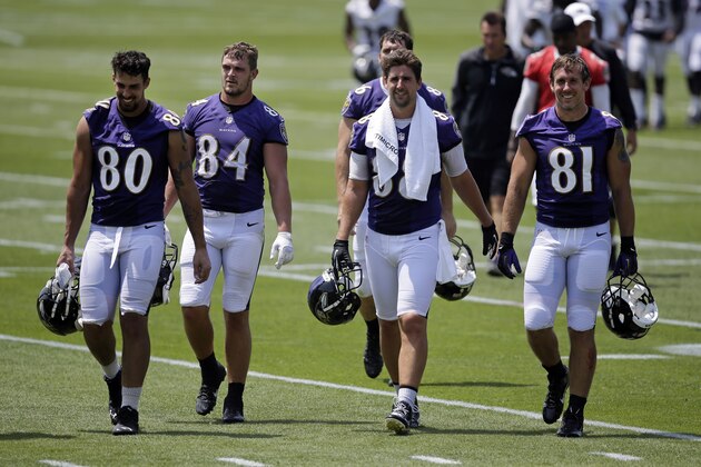 Baltimore Ravens tight ends Crockett Gillmore, from left, Phillip Supernaw, Dennis Pitta and Owen Daniels walk off the field after an NFL football practice, Wednesday, June 18, 2014, at the team's practice facility in Owings Mills, Md. (AP Photo/Patrick Semansky)