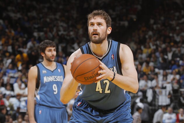 OAKLAND, CA - APRIL 14: Kevin Love #42 of the Minnesota Timberwolves shoots a free throw against the Golden State Warriors on April 14, 2014 at Oracle Arena in Oakland, California. NOTE TO USER: User expressly acknowledges and agrees that, by downloading and or using this photograph, user is consenting to the terms and conditions of Getty Images License Agreement. Mandatory Copyright Notice: Copyright 2014 NBAE (Photo by Rocky Widner/NBAE via Getty Images)
