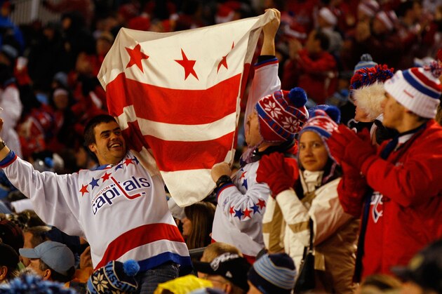 PITTSBURGH, PA - JANUARY 01:  Fans of the Washington Capitals celebrate during their game against of the Pittsburgh Penguins in the 2011 NHL Bridgestone Winter Classic at Heinz Field on January 1, 2011 in Pittsburgh, Pennsylvania.  (Photo by Mike Stobe/NHLI via Getty Images)