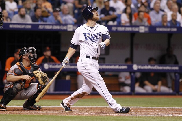 ST. PETERSBURG, FL - MAY 6:  Ben Zobrist #18 of the Tampa Bay Rays hits a sacrifice fly in front of Steve Clevenger #45 of the Baltimore Orioles to score teammate David DeJesus during the seventh inning of a game on May 6, 2014 at Tropicana Field in St. Petersburg, Florida.  (Photo by Brian Blanco/Getty Images)