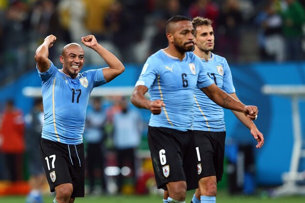 SAO PAULO, BRAZIL - JUNE 19:  Egidio Arevalo Rios of Uruguay (L) celebrates a 2-1 victory in the 2014 FIFA World Cup Brazil Group D match between Uruguay and England at Arena de Sao Paulo on June 19, 2014 in Sao Paulo, Brazil.  (Photo by Kevin C. Cox/Getty Images)