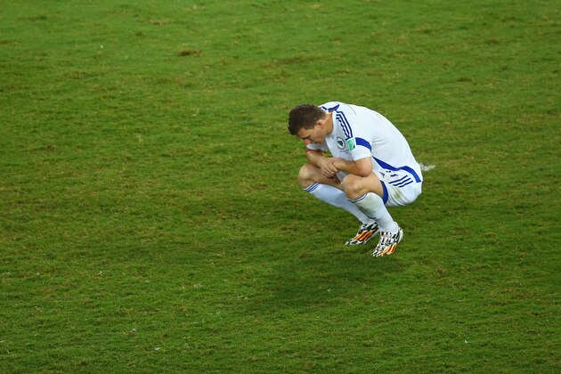 CUIABA, BRAZIL - JUNE 21:  Edin Dzeko of Bosnia and Herzegovina looks dejected after a 1-0 defeat in the 2014 FIFA World Cup Group F match between Nigeria and Bosnia-Herzegovina at Arena Pantanal on June 21, 2014 in Cuiaba, Brazil.  (Photo by Clive Brunskill/Getty Images)