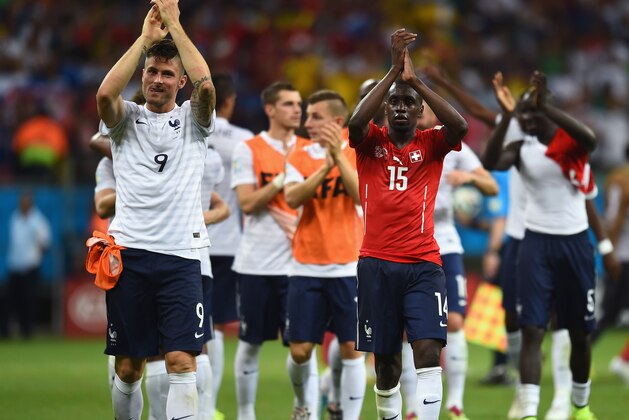 SALVADOR, BRAZIL - JUNE 20:  Olivier Giroud (L) and Blaise Matuidi of France acknowledge the fans after defeating Switzerland 5-2 during the 2014 FIFA World Cup Brazil Group E match between Switzerland and France at Arena Fonte Nova on June 20, 2014 in Salvador, Brazil.  (Photo by Christopher Lee/Getty Images)