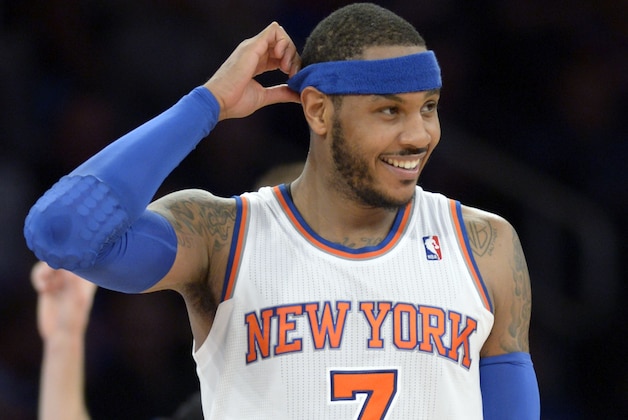 New York Knicks' Carmelo Anthony smiles during the third quarter of an NBA basketball game against the Cleveland Cavaliers Thursday, Jan. 30, 2014, at Madison Square Garden in New York. The Knicks won 117-86. (AP Photo/Bill Kostroun)