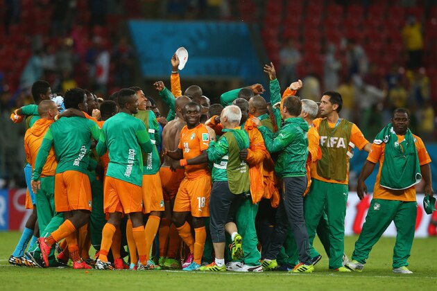 RECIFE, BRAZIL - JUNE 14: The Ivory Coast celebrate after defeating Japan 2-1 during the 2014 FIFA World Cup Brazil Group C match  between the Ivory Coast and Japan at Arena Pernambuco on June 14, 2014 in Recife, Brazil.  (Photo by Mark Kolbe/Getty Images)