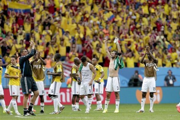 Colombian players celebrate after the group C World Cup soccer match between Colombia and Ivory Coast at the Estadio Nacional in Brasilia, Brazil, Thursday, June 19, 2014.  Colombia won the match 2-1.  (AP Photo/Marcio Jose Sanchez)