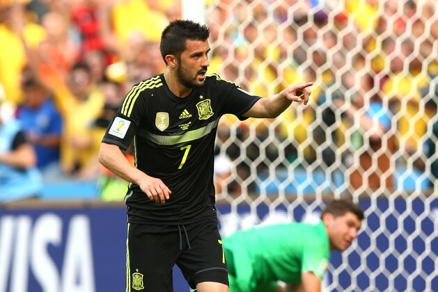 CURITIBA, BRAZIL - JUNE 23: David Villa of Spain celebrates scoring hist eam's first goal during the 2014 FIFA World Cup Brazil Group B match between Australia and Spain at Arena da Baixada on June 23, 2014 in Curitiba, Brazil.  (Photo by Quinn Rooney/Getty Images)