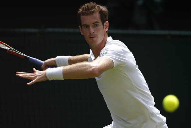 Andy Murray of Britain plays a return to David Goffin of Belgium during their first round match at the All England Lawn Tennis Championships in Wimbledon, London,  Monday, June  23, 2014. (AP Photo/Pavel Golovkin)