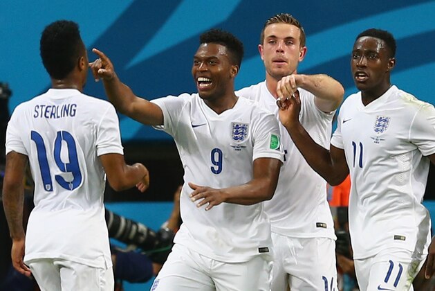 MANAUS, BRAZIL - JUNE 14: Daniel Sturridge of England (C) celebrates scoring his team's first goal with Wayne Rooney (L), Raheem Sterling (2nd L), Jordan Henderson (2nd R) and Danny Welbeck (R) during the 2014 FIFA World Cup Brazil Group D match between England and Italy at Arena Amazonia on June 14, 2014 in Manaus, Brazil.  (Photo by Elsa/Getty Images)