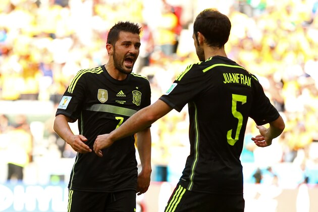 CURITIBA, BRAZIL - JUNE 23:  David Villa of Spain (L) celebrates scoring his team's first goal with Juanfran during the 2014 FIFA World Cup Brazil Group B match between Australia and Spain at Arena da Baixada on June 23, 2014 in Curitiba, Brazil.  (Photo by Cameron Spencer/Getty Images)