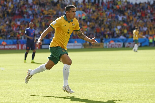 Australia's Tim Cahill celebrates after scoring his side's first goal during the group B World Cup soccer match between Australia and the Netherlands at the Estadio Beira-Rio in Porto Alegre, Brazil, Wednesday, June 18, 2014.   (AP Photo/Wong Maye-E)