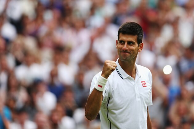 LONDON, ENGLAND - JUNE 23:  Novak Djokovic of Serbia celebrates after defeating Andrey Golubev of Kazakhstan in three straight sets during their Gentlemen's Singles first round match on day one of the Wimbledon Lawn Tennis Championships at the All England Lawn Tennis and Croquet Club at Wimbledon on June 23, 2014 in London, England.  (Photo by Matthew Stockman/Getty Images)