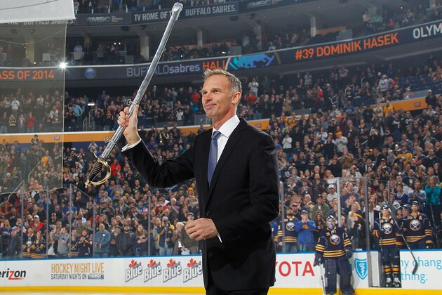 BUFFALO, NY - MARCH 29: Former Buffalo Sabres goaltender Dominik Hasek flashes his saber to an appreciative crowd after being the 42nd member inducted into the Buffalo Sabres Hall of Fame prior to the game against the Tampa Bay Lightning on March 29, 2014 at the First Niagara Center in Buffalo, New York.  (Photo by Bill Wippert/NHLI via Getty Images)