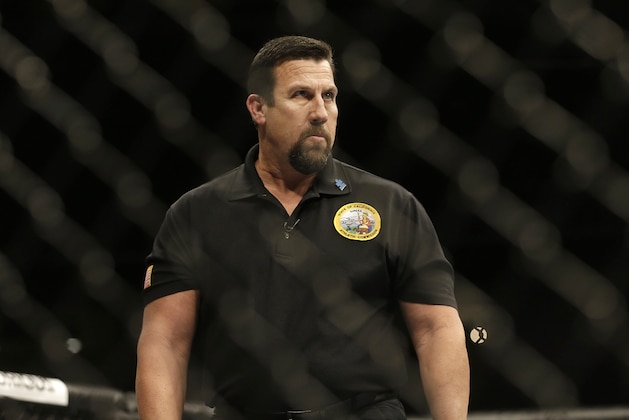 Referee John McCarthy during a UFC bantamweight mixed martial arts fight in San Jose, Calif., Saturday, April 20, 2013. (AP Photo/Jeff Chiu)
