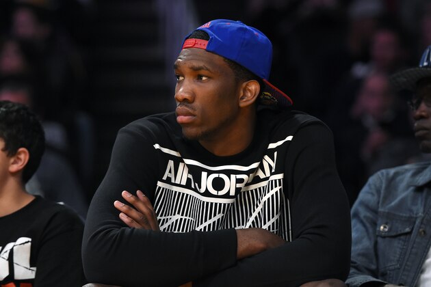 Kansas center Joel Embiid watches the Los Angeles Lakers play the Memphis Grizzlies in an NBA basketball game, Sunday, April 13, 2014, in Los Angeles. The Grizzlies won 102-90. (AP Photo/Mark J. Terrill) Kansas center Joel Embiid watches the Los Angeles Lakers play the Memphis Grizzlies in an NBA basketball game, Sunday, April 13, 2014, in Los Angeles. The Grizzlies won 102-90. (AP Photo/Mark J. Terrill)