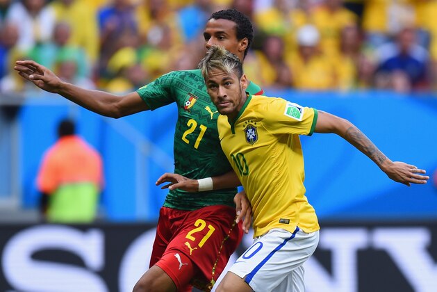 BRASILIA, BRAZIL - JUNE 23: Joel Matip of Cameroon competes for the ball with Neymar of Brazil during the 2014 FIFA World Cup Brazil Group A match between Cameroon and Brazil at Estadio Nacional on June 23, 2014 in Brasilia, Brazil.  (Photo by Stu Forster/Getty Images)