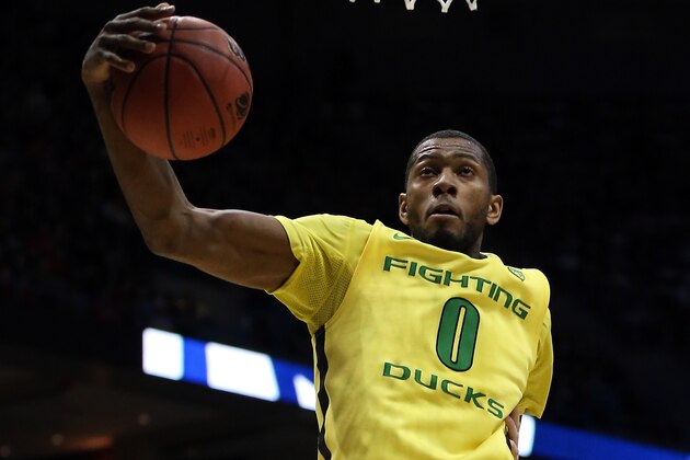 MILWAUKEE, WI - MARCH 20:  Mike Moser #0 of the Oregon Ducks grabs a rebound during the second round game of NCAA Basketball Tournament against the Brigham Young Cougars at BMO Harris Bradley Center on March 20, 2014 in Milwaukee, Wisconsin.  (Photo by Jonathan Daniel/Getty Images)