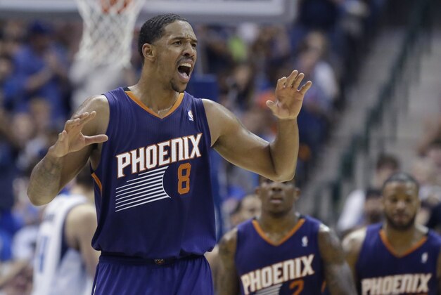 Phoenix Suns forward Channing Frye (8) reacts to a call against his team during the second half of an NBA basketball game against the Dallas Mavericks, Saturday, April 12, 2014, in Dallas. The Mavericks won 101-98. (AP Photo/LM Otero)