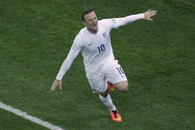 England's Wayne Rooney celebrates scoring his side's first goal during the group D World Cup soccer match between Uruguay and England at the Itaquerao Stadium in Sao Paulo, Brazil, Thursday, June 19, 2014.  (AP Photo/Michael Sohn)