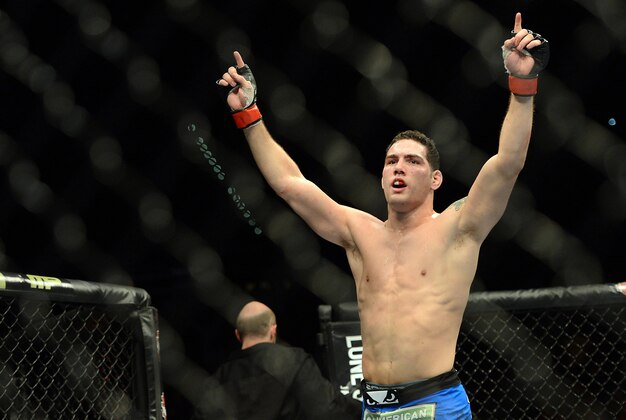 Dec 28, 2013; Las Vegas, NV, USA;    Chris Weidman reacts in the cage after defeating Anderson Silva (not pictured) in their UFC middleweight championship bout at the MGM Grand Garden Arena. Mandatory Credit: Jayne Kamin-Oncea-USA TODAY Sports