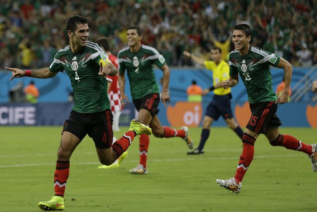 Mexico's Rafael Marquez celebrates after scoring  the first goal of his team during the group A World Cup soccer match between Croatia and Mexico at the Arena Pernambuco in Recife, Brazil, Monday, June 23, 2014. Mexico won 3-1.(AP Photo/Ricardo Mazalan)
