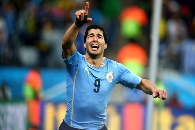 SAO PAULO, BRAZIL - JUNE 19: Luis Suarez of Uruguay celebrates after scoring his team's second goal during the 2014 FIFA World Cup Brazil Group D match between Uruguay and England at Arena de Sao Paulo on June 19, 2014 in Sao Paulo, Brazil.  (Photo by Julian Finney/Getty Images)