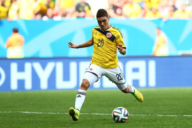 BRASILIA, BRAZIL - JUNE 19:  Juan Fernando Quintero of Colombia scores his team's second goal during the 2014 FIFA World Cup Brazil Group C match between Colombia and Cote D'Ivoire at Estadio Nacional on June 19, 2014 in Brasilia, Brazil.  (Photo by Elsa/Getty Images)