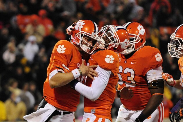 Clemson quarterback Cole Stoudt celebrates a touchdown with Mike Williams during the second half of an NCAA college football game against Georgia Tech Thursday, Nov.14, 2013, at Memorial Stadium in Clemson, S.C.Clemson won 55-31. (AP Photo/ Richard Shiro)