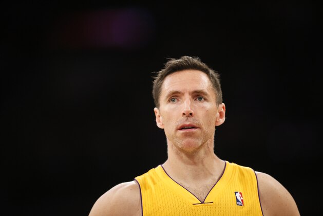 Los Angeles Lakers guard Steve Nash stands on the court against the Portland Trail Blazers during the first half of an NBA basketball game in Los Angeles, Tuesday, April 1, 2014. (AP Photo/Danny Moloshok)