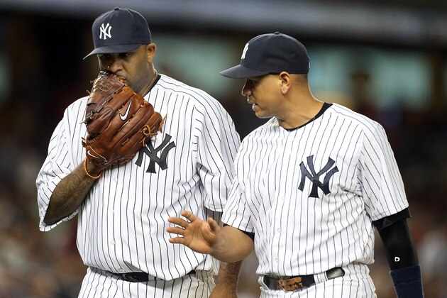 NEW YORK, NY - SEPTEMBER 14: Alex Rodriguez #13 of the New York Yankees talks with teammate CC Sabathia #52 as they walk to the dugout after the second inning against the Tampa Bay Rays at Yankee Stadium on September 14, 2012 in the Bronx borough of New York City. (Photo by Jim McIsaac/Getty Images)