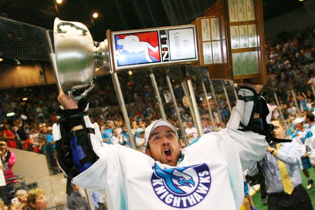 In a photo provided by the National Lacrosse League, Rochester Knighthawks goaltender Jeff Vinc hoists the Champion's Cup, the National Lacrosse League's top prize, after the Knighthawks defeated the Edmonton Rush with a 9-6 comeback win Saturday, May 19, 2012, in Rochester, N.Y. (AP Photo/The Canadian Press, Bill Wippert, National Lacrosse League)
