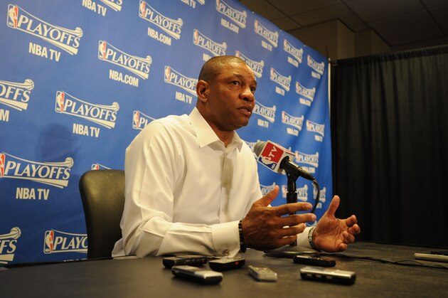 LOS ANGELES, CA - APRIL 19: Doc Rivers of the Los Angeles Clippers speaks to the media before Game One of the Western Conference Quarterfinals of the NBA Playoffs against the Golden State Warriors at STAPLES Center on April 19, 2014 in Los Angeles, California. NOTE TO USER: User expressly acknowledges and agrees that, by downloading and/or using this Photograph, user is consenting to the terms and conditions of the Getty Images License Agreement. Mandatory Copyright Notice: Copyright 2014 NBAE (Photo by Andrew D. Bernstein/NBAE via Getty Images)