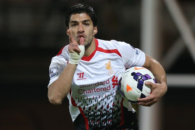 Liverpool's Luis Suarez celebrates after scoring his side's third goal, during the English Premier League soccer match between Crystal Palace and Liverpool at Selhurst Park stadium in London, Monday, May 5, 2014. (AP Photo/Alastair Grant)