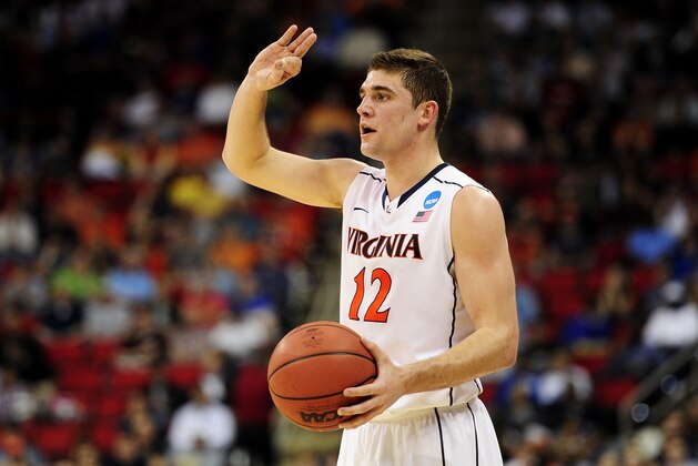 RALEIGH, NC - MARCH 21:  Joe Harris #12 of the Virginia Cavaliers signals in the first half against the Coastal Carolina Chanticleers during the Second Round of the 2014 NCAA Basketball Tournament at PNC Arena on March 21, 2014 in Raleigh, North Carolina.  (Photo by Grant Halverson/Getty Images)
