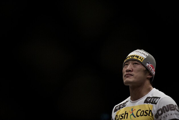 MACAU - MARCH 01:  Dong Hyun Kim of South Korea looks on the octagon after defeating John Hathaway of England by knockout in their welterweight bout during the UFC Fight Night at the Cotai Arena on March 1, 2014 in Macau, China.  (Photo by Victor Fraile/Getty Images)