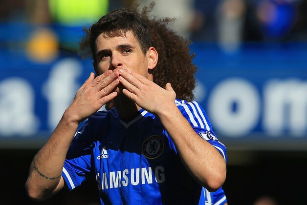 LONDON, ENGLAND - MARCH 22:  Oscar of Chelsea celebrates scoring their fourth goal during the Barclays Premier League match between Chelsea and Arsenal at Stamford Bridge on March 22, 2014 in London, England.  (Photo by Richard Heathcote/Getty Images)