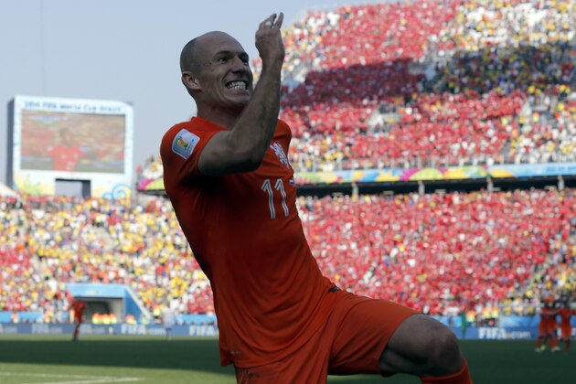 Netherlands' Arjen Robben after his teammate Memphis Depay scored their second goal during the group B World Cup soccer match between the Netherlands and Chile at the Itaquerao Stadium in Sao Paulo, Brazil, Monday, June 23, 2014. The Dutch team beat Chile 2-0 to top Group B. (AP Photo/Frank Augstein)