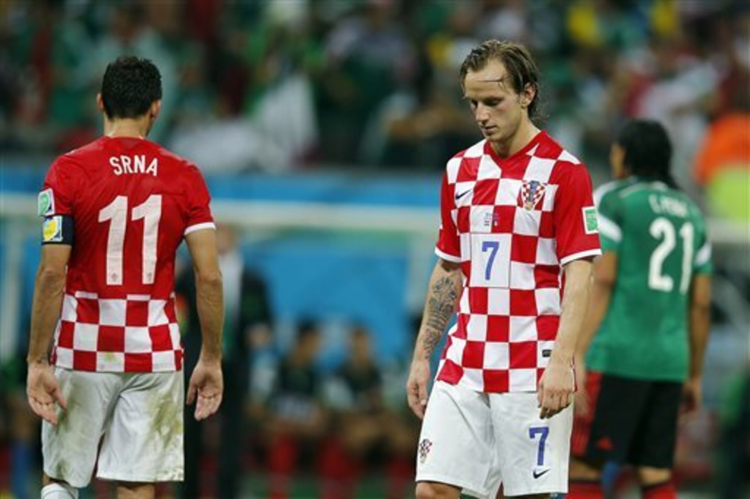 CORRECTS FINAL SCORE TO 3-1 Croatia's Ivan Rakitic (7) reacts at the end of the group A World Cup soccer match between Croatia and Mexico at the Arena Pernambuco in Recife, Brazil, Monday, June 23, 2014. Mexico won 3-1. (AP Photo/Eduardo Verdugo)