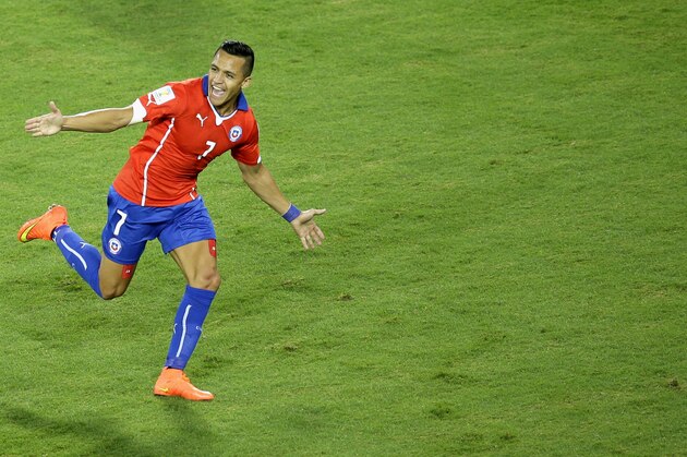 Chile's Alexis Sanchez celebrates after scoring during the group B World Cup soccer match between Chile and Australia in the Arena Pantanal in Cuiaba, Brazil, Friday, June 13, 2014. (AP Photo/Michael Sohn)