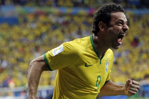 Brazil's Fred celebrates scoring his side's third goal during the group A World Cup soccer match between Cameroon and Brazil at the Estadio Nacional in Brasilia, Brazil, Monday, June 23, 2014. (AP Photo/Dolores Ochoa)