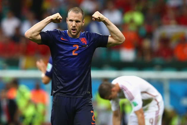 SALVADOR, BRAZIL - JUNE 13:  Ron Vlaar of the Netherlands gestures to the crowd after defeating Spain 5-1 during the 2014 FIFA World Cup Brazil Group B match between Spain and Netherlands at Arena Fonte Nova on June 13, 2014 in Salvador, Brazil.  (Photo by Quinn Rooney/Getty Images)