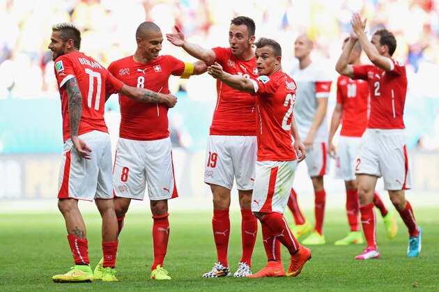 BRASILIA, BRAZIL - JUNE 15:  (L - R) Valon Behrami; Gokhan Inler; Josip Drmic and Xherdan Shaqiri of Switzerland celebrate after defeating Ecuador 2-1 in the 2014 FIFA World Cup Brazil Group E match between Switzerland and Ecuador at Estadio Nacional on June 15, 2014 in Brasilia, Brazil.  (Photo by Stu Forster/Getty Images)