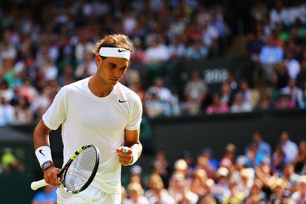 LONDON, ENGLAND - JUNE 24:  Rafael Nadal of Spain celebrates a point during his Gentlemen's Singles first round match against Martin Klizan of Slovakia on day two of the Wimbledon Lawn Tennis Championships at the All England Lawn Tennis and Croquet Club at Wimbledon on June 24, 2014 in London, England.  (Photo by Al Bello/Getty Images)