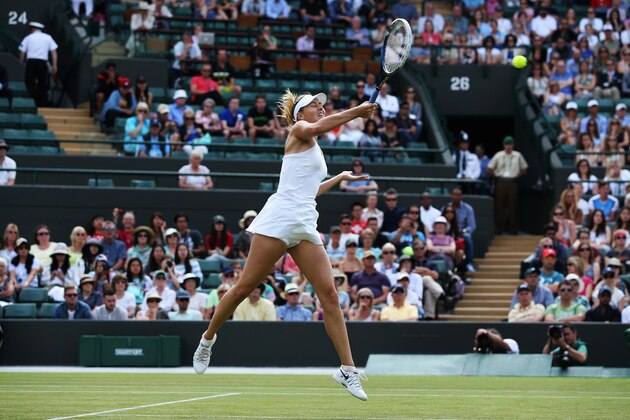 LONDON, ENGLAND - JUNE 24: Maria Sharapova of Russia plays a forehand during her Ladies' Singles first round match against against Samantha Murray of Great Britain on day two of the Wimbledon Lawn Tennis Championships at the All England Lawn Tennis and Croquet Club at Wimbledon on June 24, 2014 in London, England. (Photo by Jan Kruger/Getty Images) LONDON, ENGLAND - JUNE 24: Maria Sharapova of Russia plays a forehand during her Ladies' Singles first round match against against Samantha Murray of Great Britain on day two of the Wimbledon Lawn Tennis Championships at the All England Lawn Tennis and Croquet Club at Wimbledon on June 24, 2014 in London, England. (Photo by Jan Kruger/Getty Images)