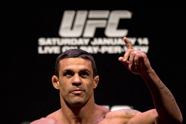 Mixed Martial Arts, MMA, fighter Vitor Belfort, from Brazil, gestures to fans as he weighs-in ahead of the Ultimate Fighting Championship, UFC, 142 in Rio de Janeiro, Brazil, Friday, Jan. 13, 2012. Belfort will face Anthony Johnson, from the U.S., Friday. (AP Photo/Felipe Dana)